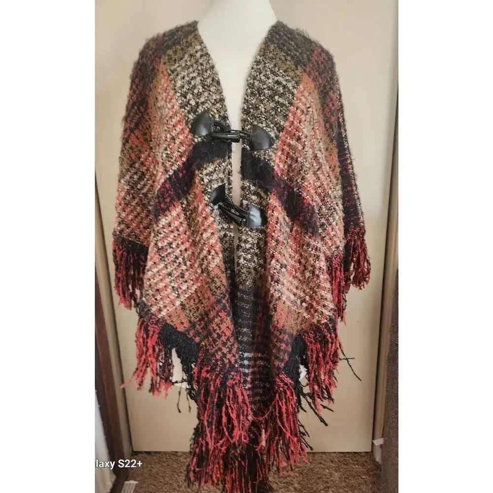 024 Coco & Carmen soft knitted cape fastens w toggles. Orange n brown Fall Color